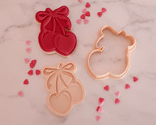 Load image into Gallery viewer, Cherries with Bow Fondant Pop Embosser and Cutter - Made in the UK with Love  from House of Toot Sweet - Just £6.50! Shop now at House of Toot Sweet
