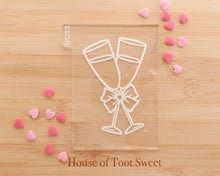 Load image into Gallery viewer, Champagne Glasses with Bow Embosser Embosser / Cutter - Made in the UK with Love  from House of Toot Sweet - Just £6! Shop now at House of Toot Sweet
